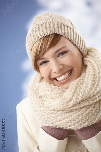 Happy young woman in winter clothes photo