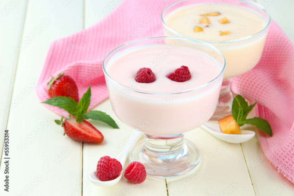Delicious yogurt with fruit and berries on table close-up Delicious yogurt with fruit and berries on table close-up