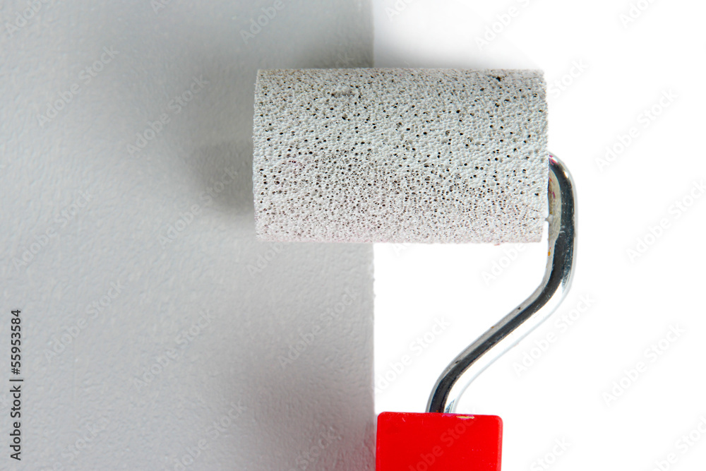 Obraz premium Roller brush with grey paint closeup