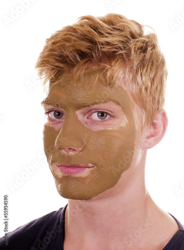 Teenager mit Heilerde Gesichtsmaske photo