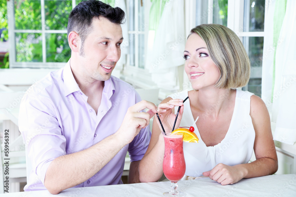 Beautiful couple drinking together cocktail at restaurant Beautiful couple drinking together cocktail at restaurant