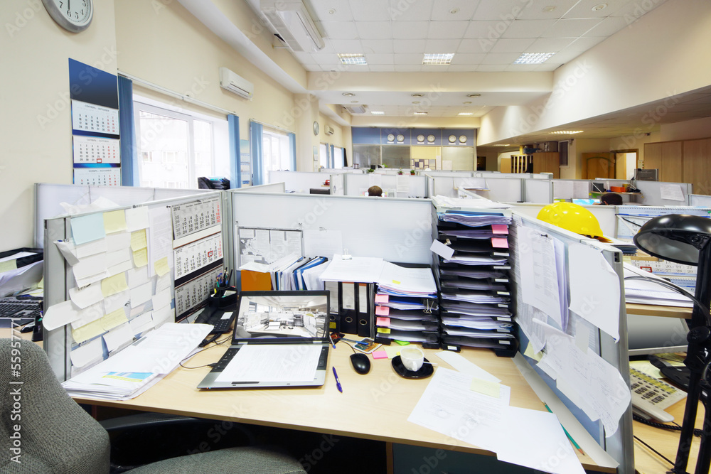 Empty official place separated by partition with desk, notebook Empty official place separated by partition with desk, notebook
