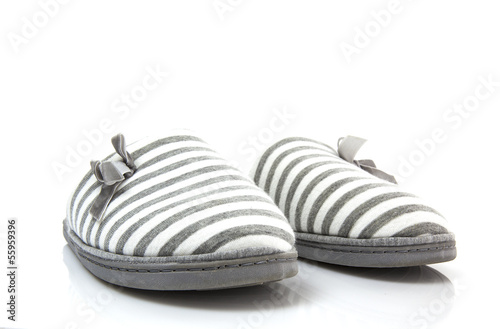 Quadro su tela Pair of grey slippers on a white background