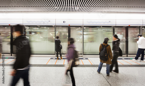blur people walk at subway station
