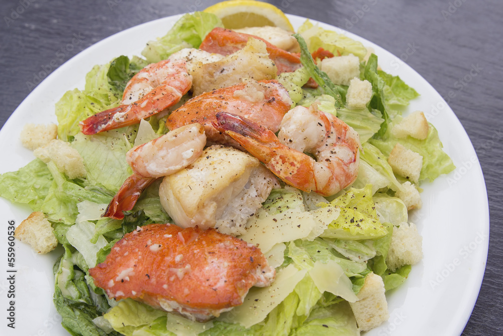 Caesar Salad with Prawns Salmon and White Fish Closeup Caesar Salad with Prawns Salmon and White Fish Closeup