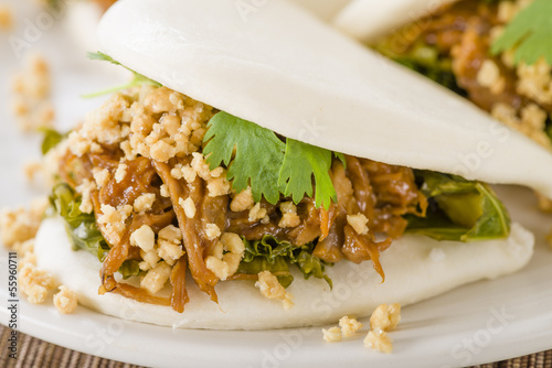 Gua Bao - Taiwanese burger with braised pork and peanuts. photo