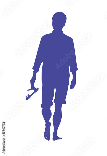 Silhouette Of A Man Walking Barefoot On A Beach