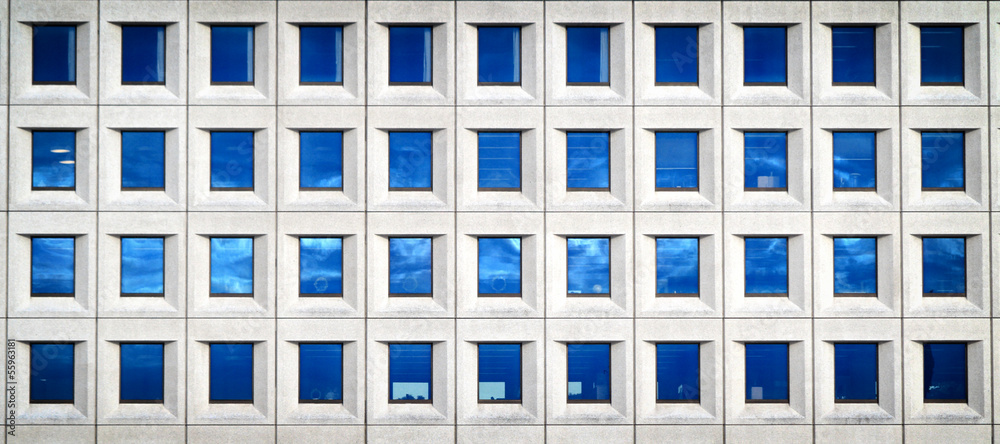 Modern futuristic business building in city Modern futuristic business building in city