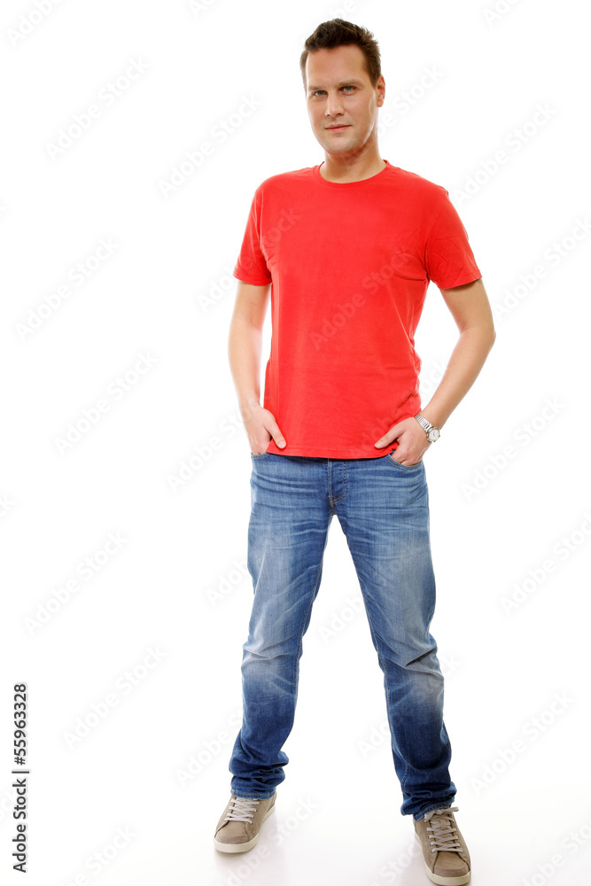 Young guy with hands in pockets isolated
