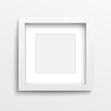 White square frame on gray wall.