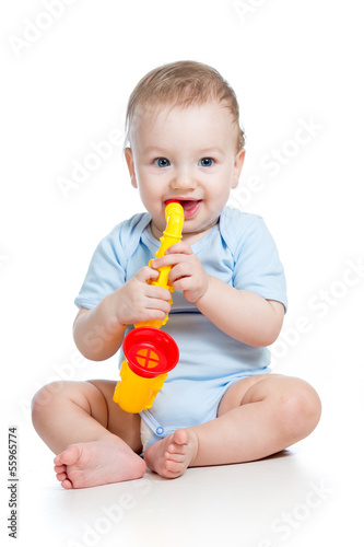child boy playing musical t...