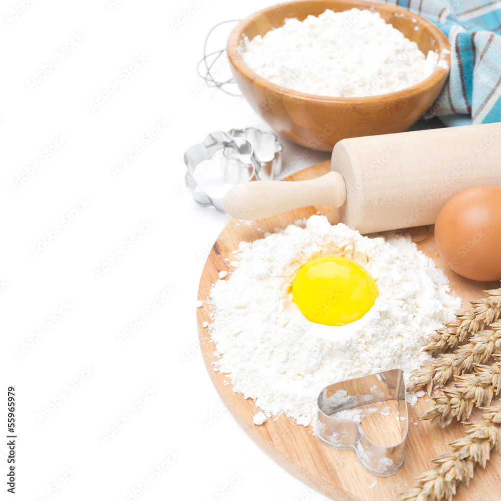 baking ingredients - flour, egg and baking forms, isolated baking ingredients - flour, egg and baking forms, isolated