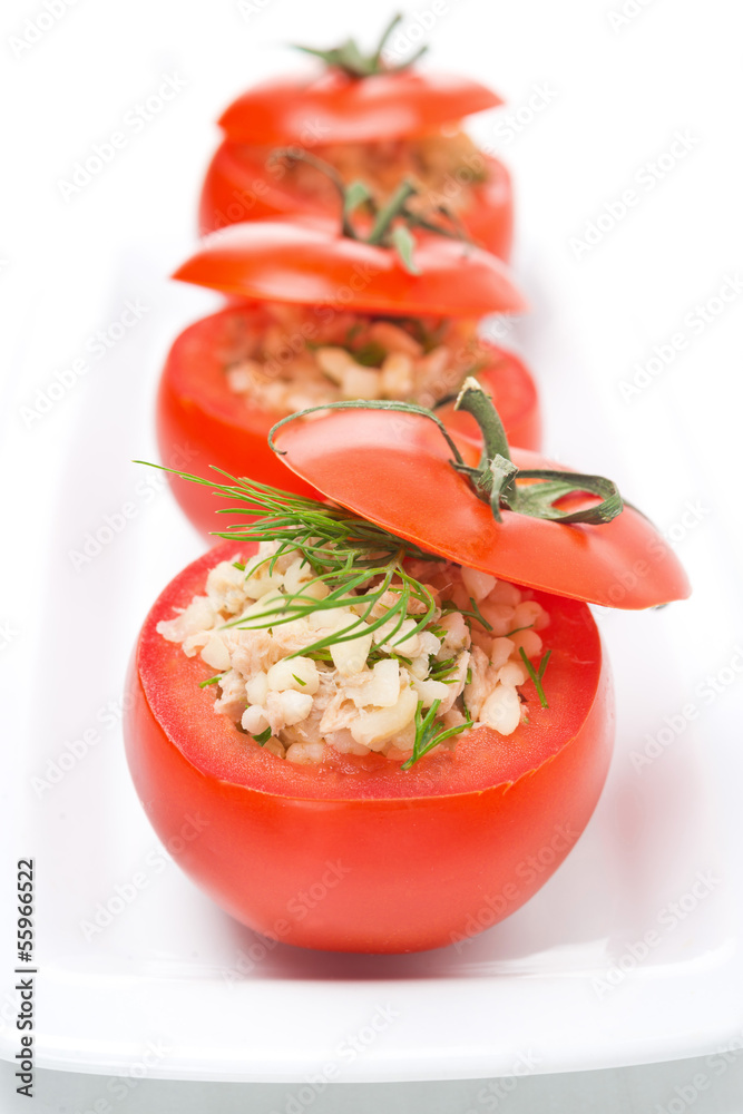 Fresh tomatoes stuffed with tuna salad and bulgur, vertical Fresh tomatoes stuffed with tuna salad and bulgur, vertical