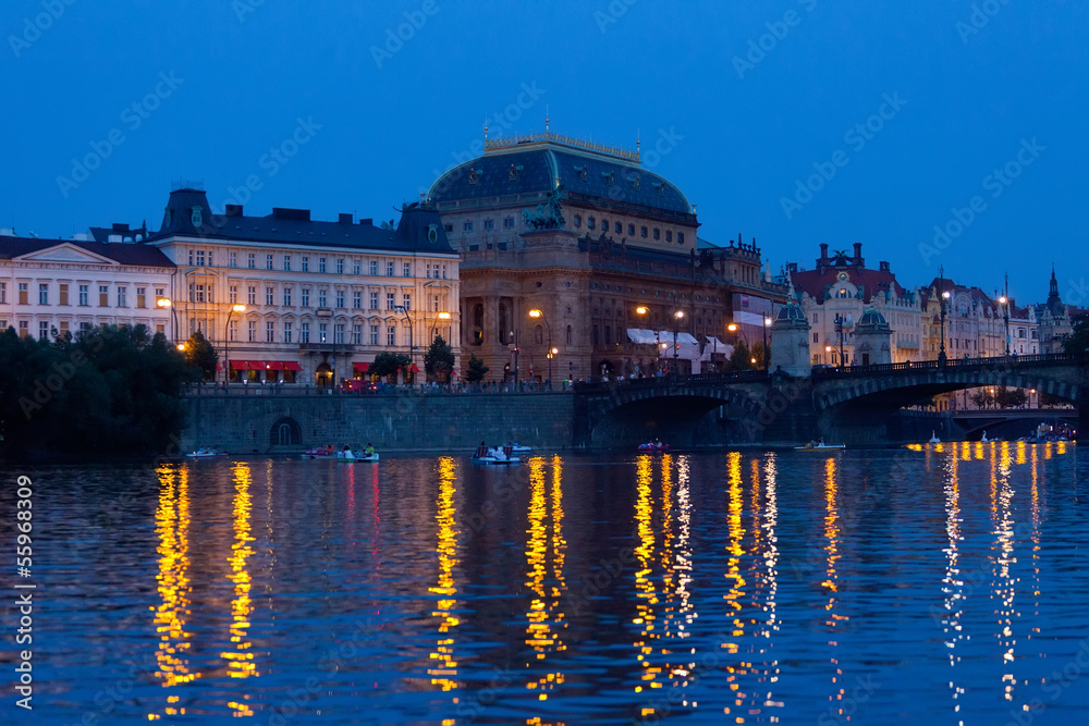 Prague, view of theater and Vltava Embankment in the evening