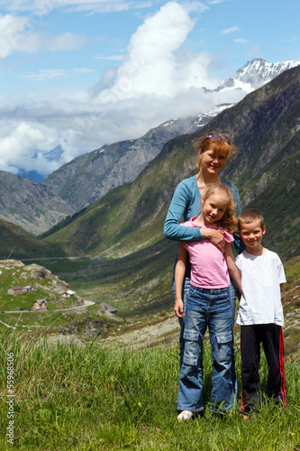 Family on summer Alps mountain