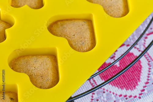 Vanilla  sponge cake hearts in yellow silicone mold photo