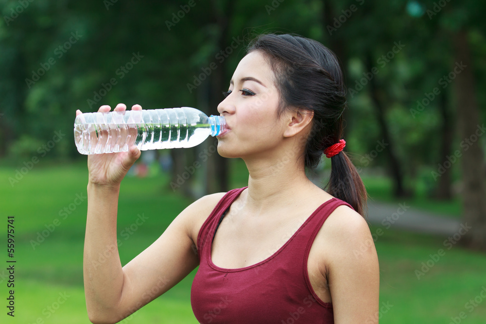 young woman drinking water young woman drinking water