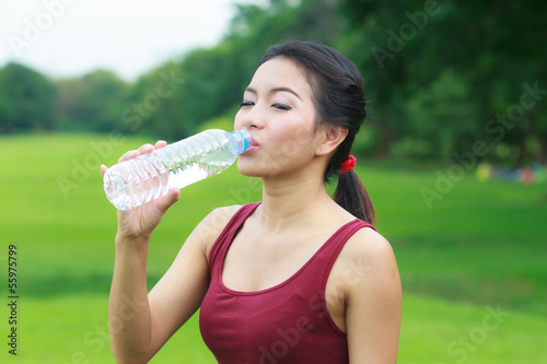 young woman drinking water