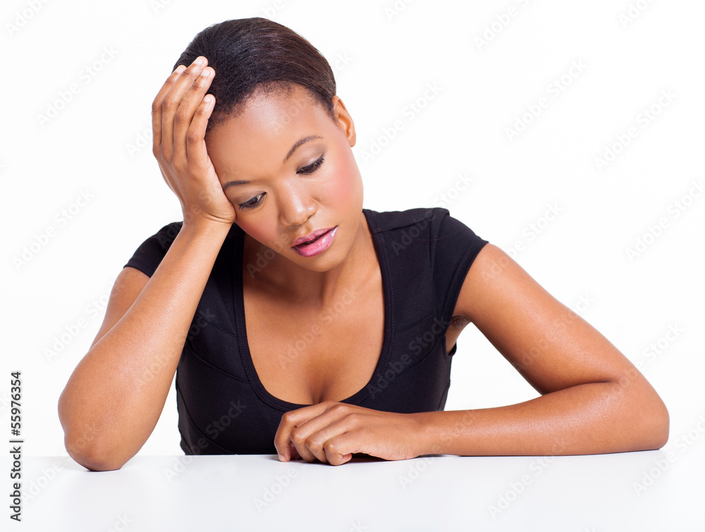 sad african american woman sitting at a desk sad african american woman sitting at a desk