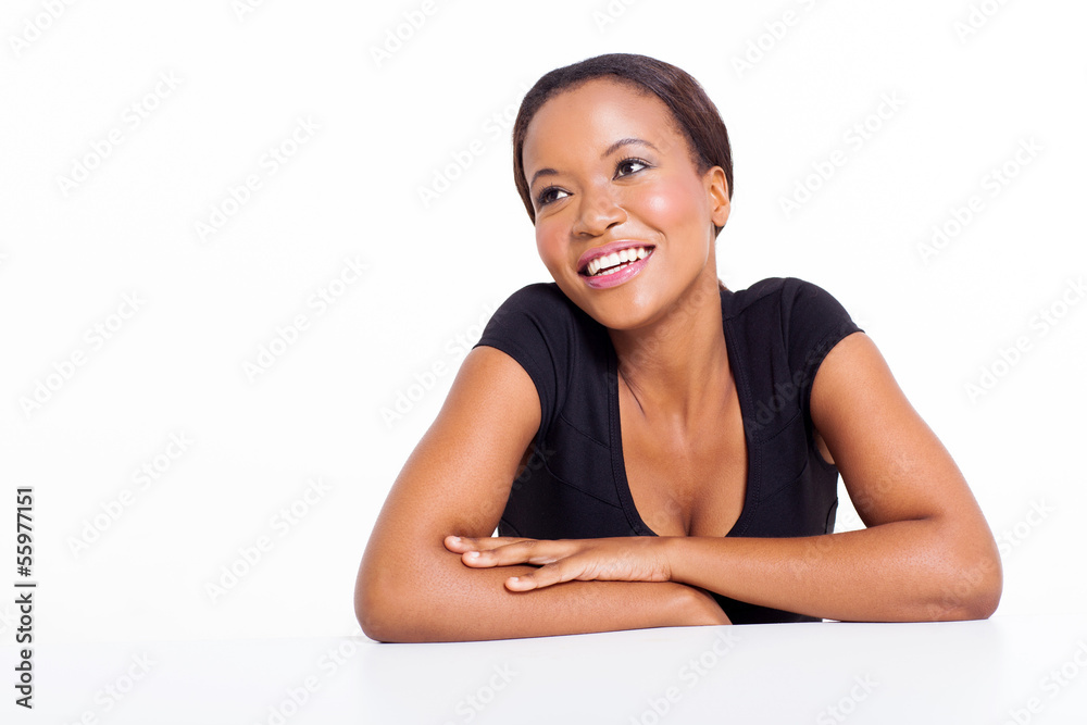 african woman sitting at a desk fantasizing african woman sitting at a desk fantasizing