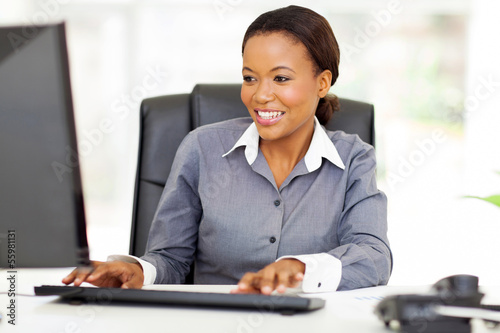 young african american businesswoman working on computer