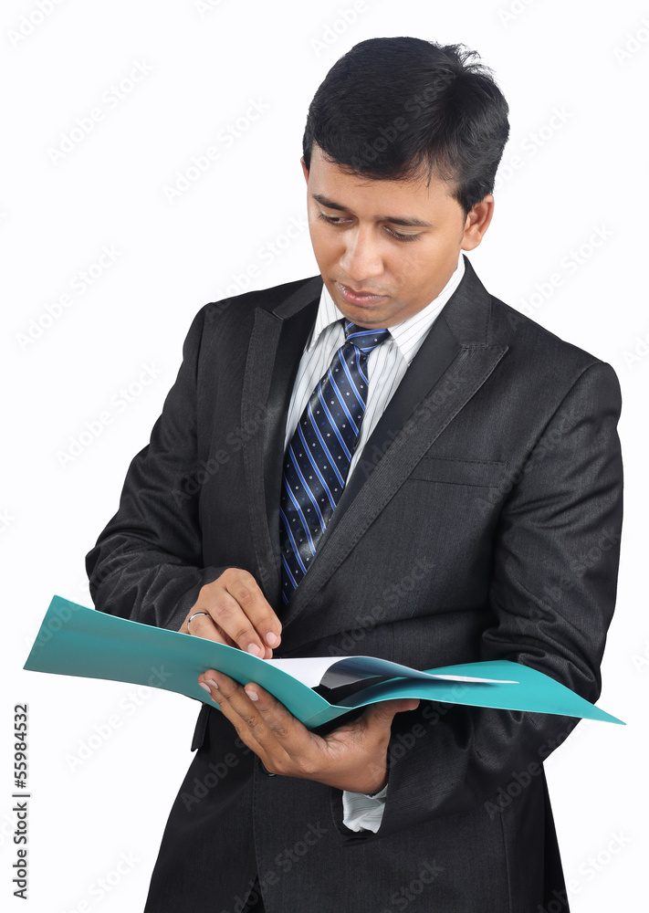 Indian businessman checking the documents Indian businessman checking the documents
