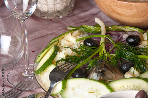 potatoes with herring on the table photo