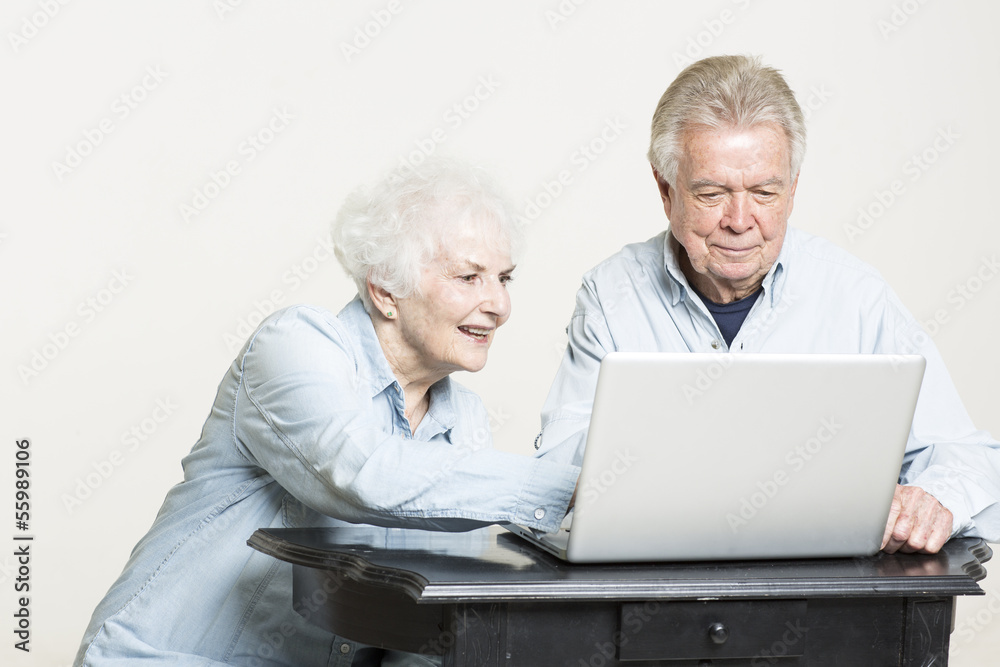 Senior couple is looking at computer screen Senior couple is looking at computer screen