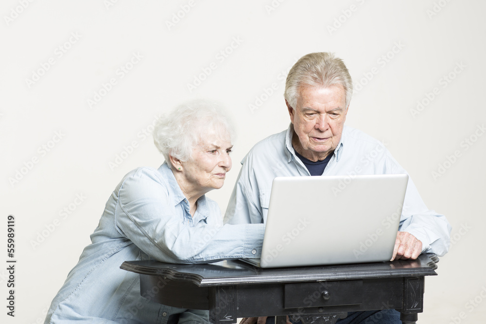 Senior couple is looking at the bills concerned Senior couple is looking at the bills concerned