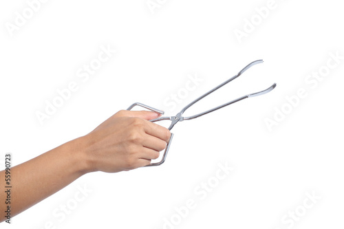 Woman hand holding an opened kitchen tongs