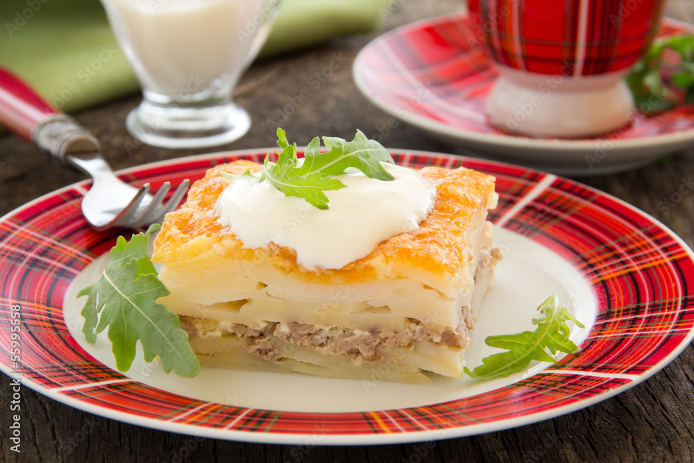 Potato gratin with cheese and meat.