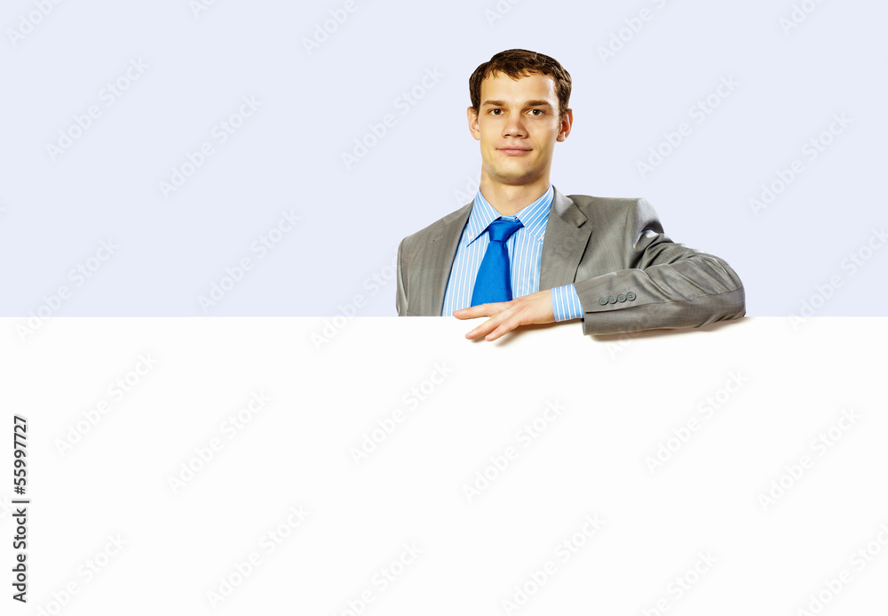 Businessman holding blank banner