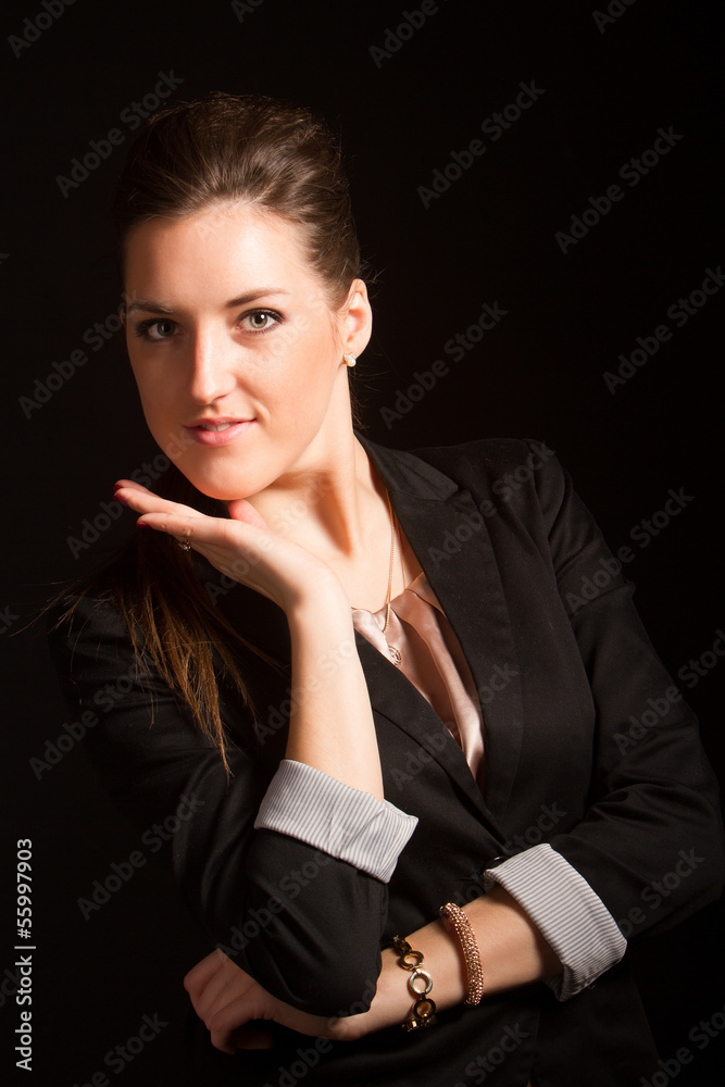 Portrait of beautiful woman posing in studio in jacket Portrait of beautiful woman posing in studio in jacket