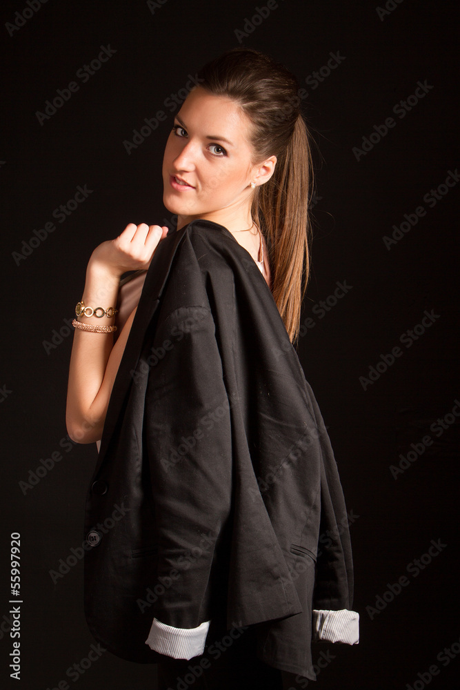 Portrait of beautiful woman posing in studio with jacket Portrait of beautiful woman posing in studio with jacket