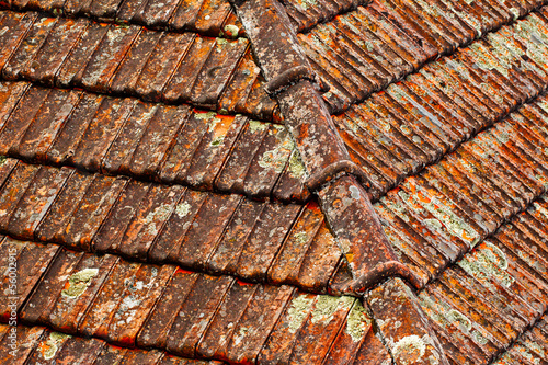 Old brown shingles on a roof
