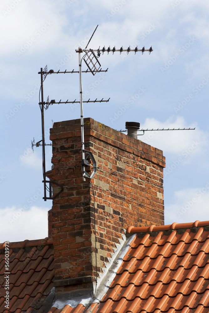 television aerial attached to an old chimney television aerial attached to an old chimney