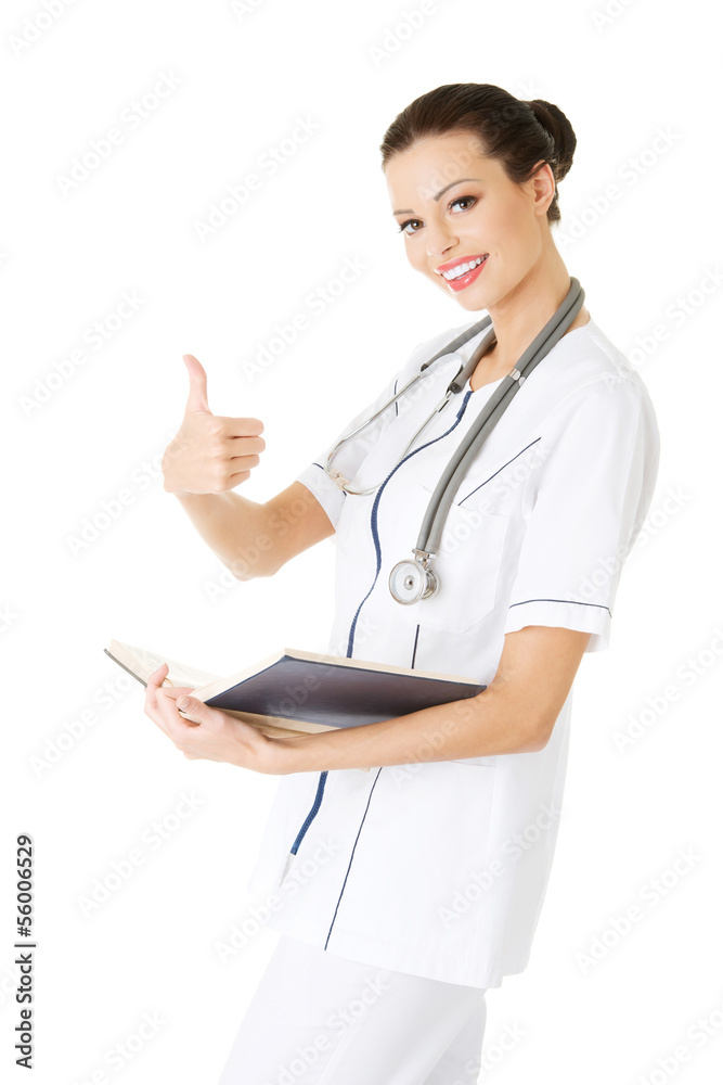 Attractive medicine student or doctor with book Attractive medicine student or doctor with book