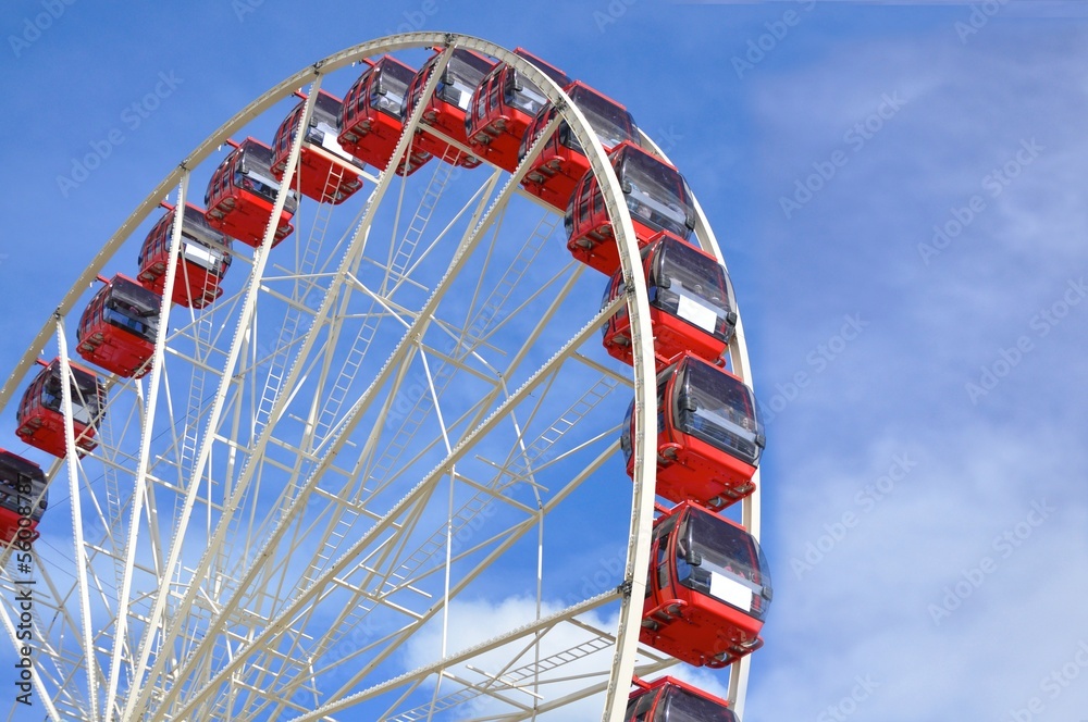 Fototapeta premium red ferris wheel with blue sky