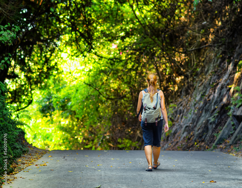 Young woman hiking with backpack Young woman hiking with backpack