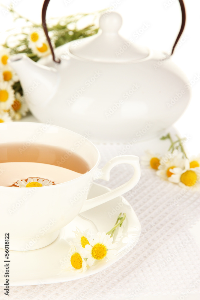 Cup of herbal tea with camomiles close up Cup of herbal tea with camomiles close up