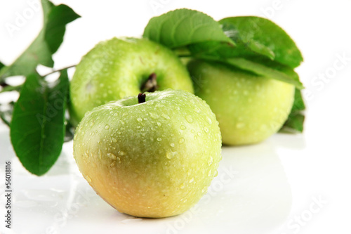 Juicy green apples with leaves, isolated on white