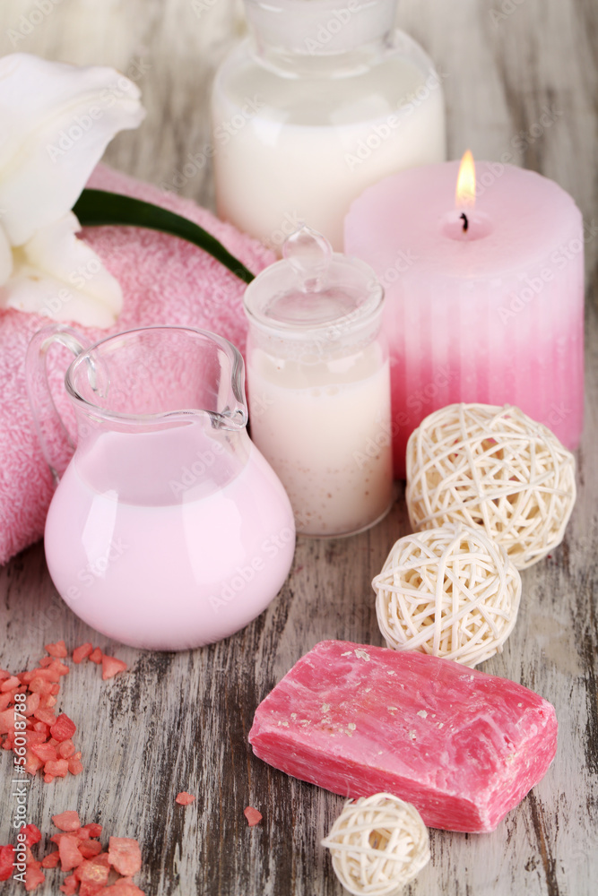 Beautiful spa setting with lily on wooden table close-up Beautiful spa setting with lily on wooden table close-up