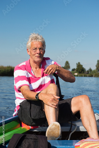 man in boat at the river