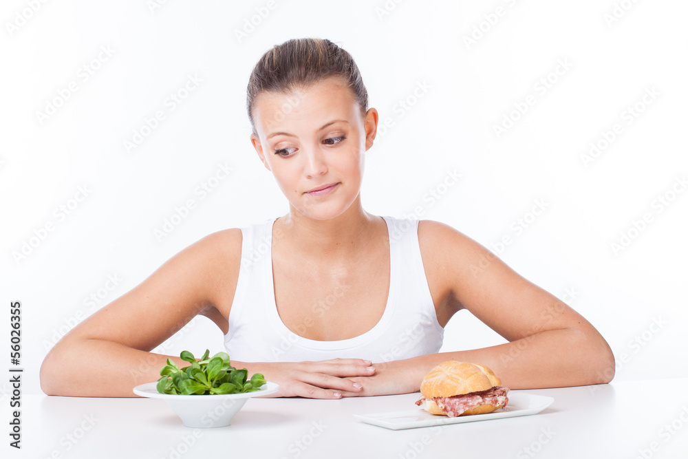 Woman choose between healthy and unhealthy food
