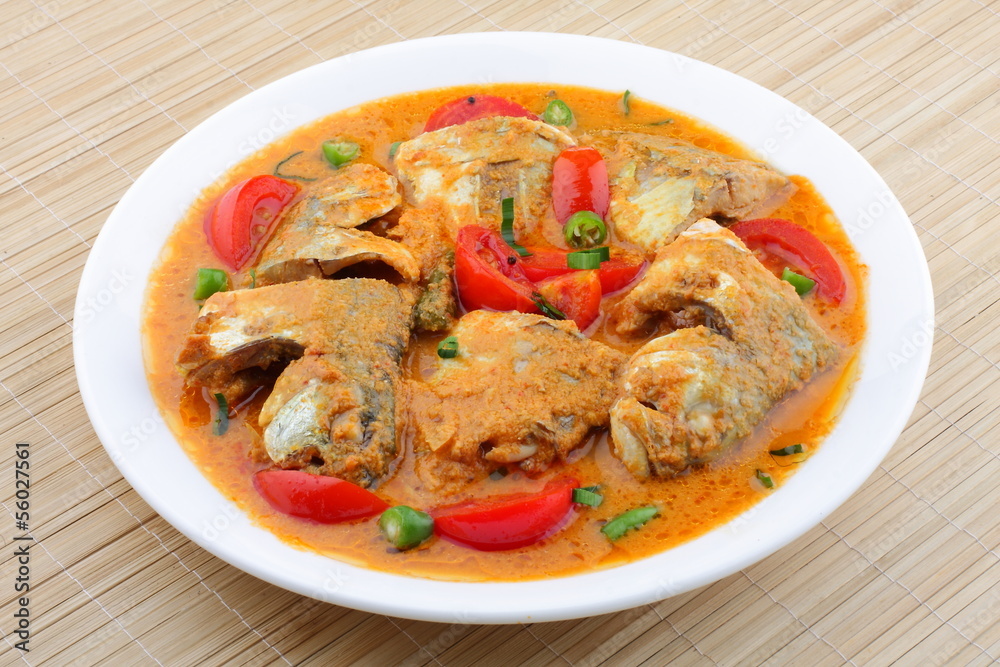 Coconut milk tomato fish curry. Stock Photo | Adobe Stock