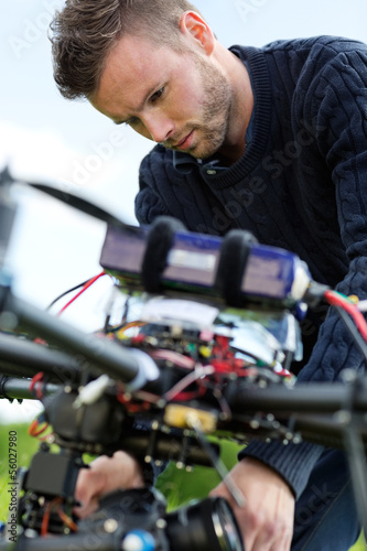 Technician Fixing Camera On UAV Drone