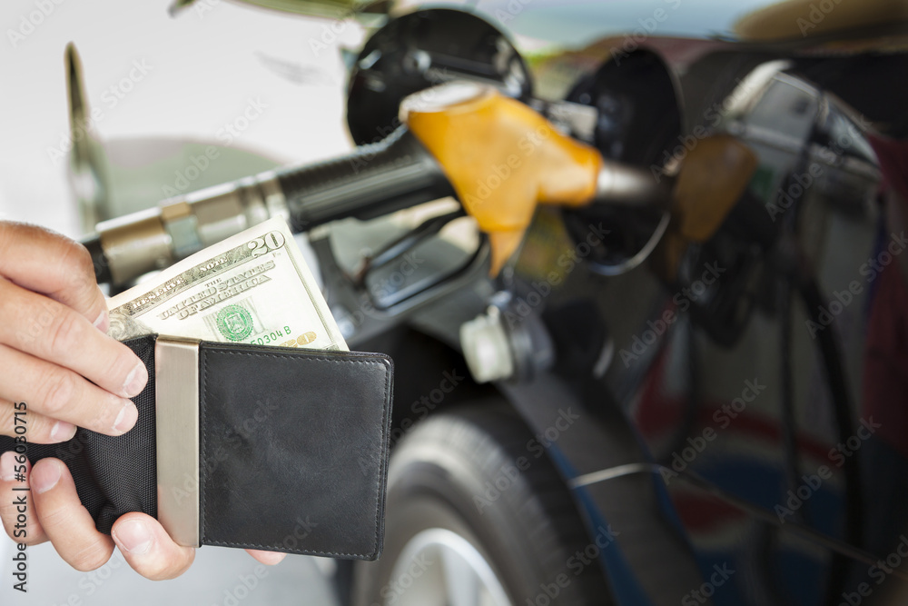 man counting money with gasoline refueling car at fuel station man counting money with gasoline refueling car at fuel station