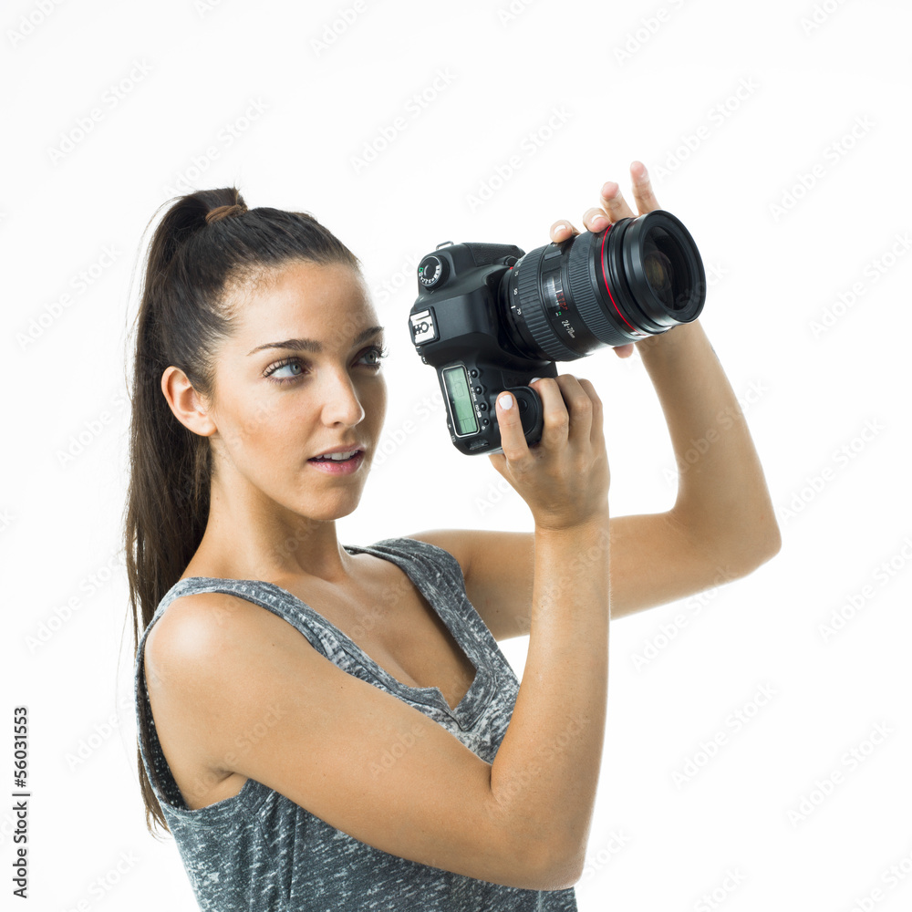 woman with camera could be a tourist or a proffesional woman with camera could be a tourist or a proffesional