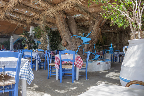 typical Greek taverna with white and blue objects  photo