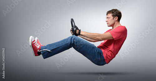 Cool man car driver in gloved with a wheel, auto concept